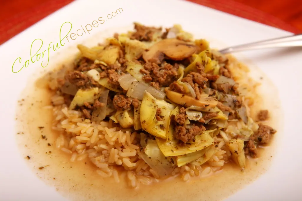 Artichoke mushroom beef stew with ground beef and artichoke hearts served over brown rice