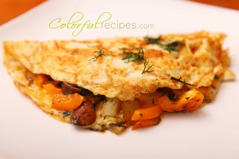 Egg white dill omelet folded over sautéed mushrooms, orange sweet pepper and melted cheese