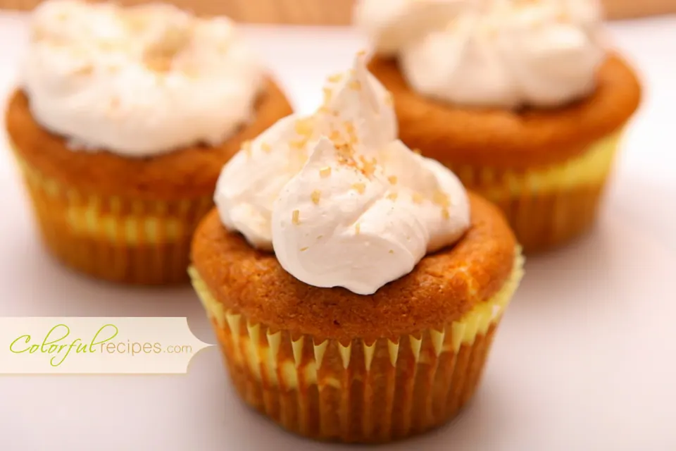 Pumpkin cheesecake cupcakes in baking liners