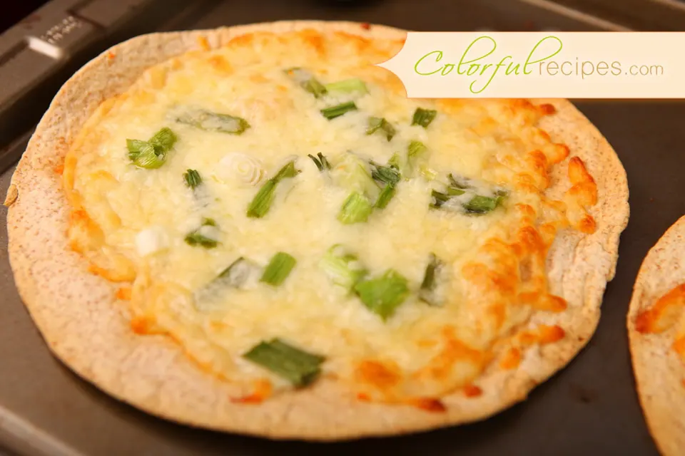 Crispy baked cheese tortilla on a baking sheet
