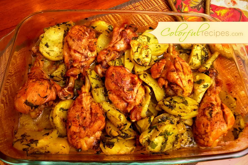 Baking dish of garlic lemon chicken and potatoes
