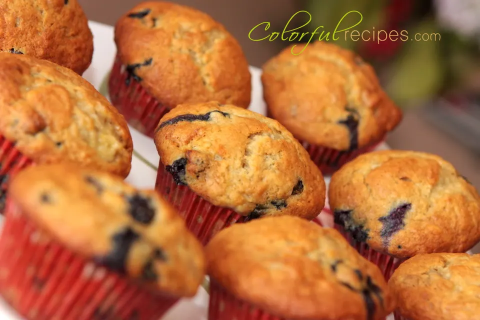 Moist banana blueberry muffins in red paper liners