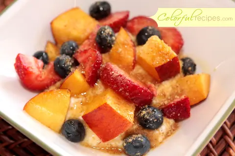Ricotta summer fruit with honey, topped with peaches, strawberries, blueberries and wheat germ