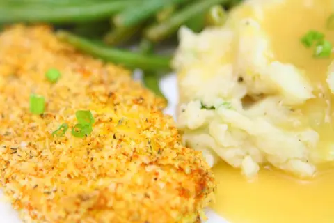 Italian oven fried crispy chicken breast served with mashed potatoes, gravy and green beans