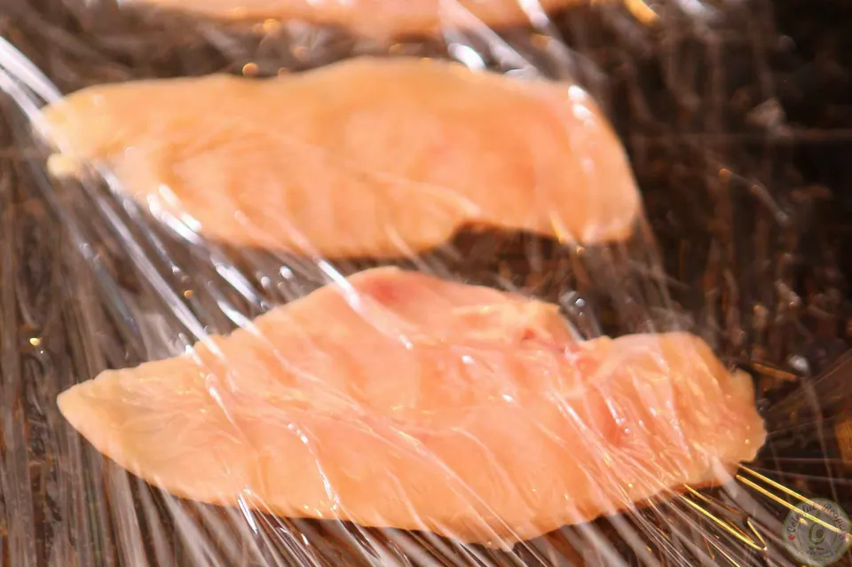 Chicken breast halves between plastic wrap, pounded thin for oven fried chicken