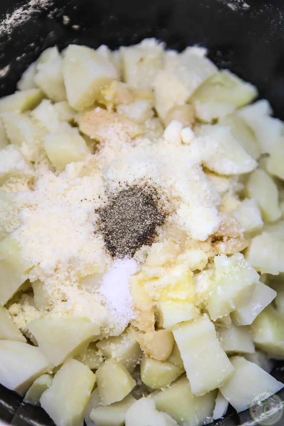 Roasted garlic parmesan mashed potatoes topped with minced green onions