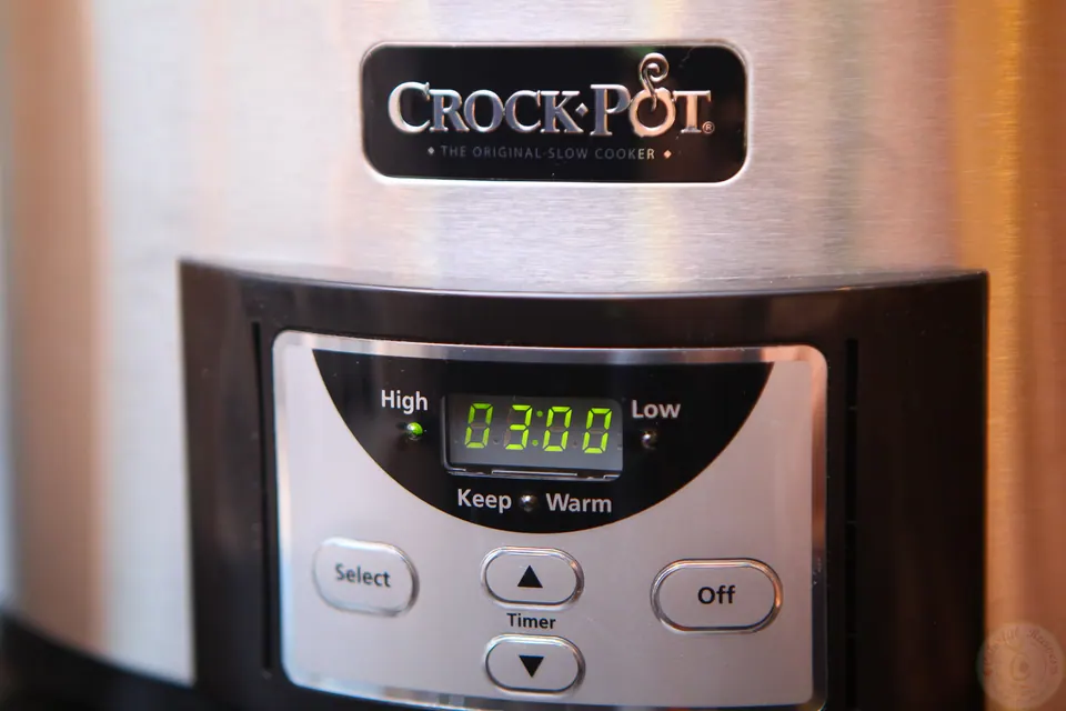 Crockpot display set to cook the stuffed peppers on high for 3 hours