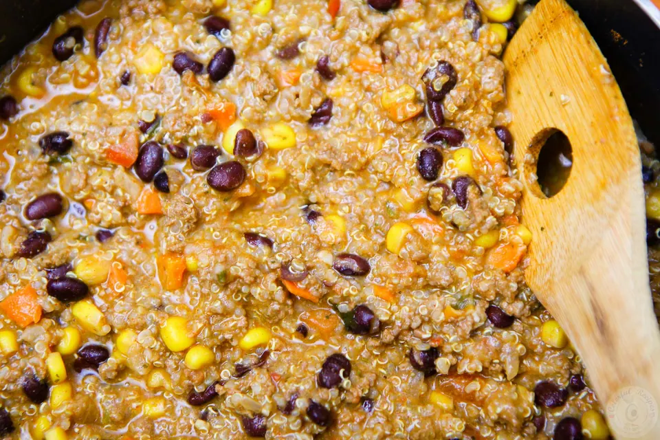Cooked beef, quinoa, black bean and corn taco filling in a pan