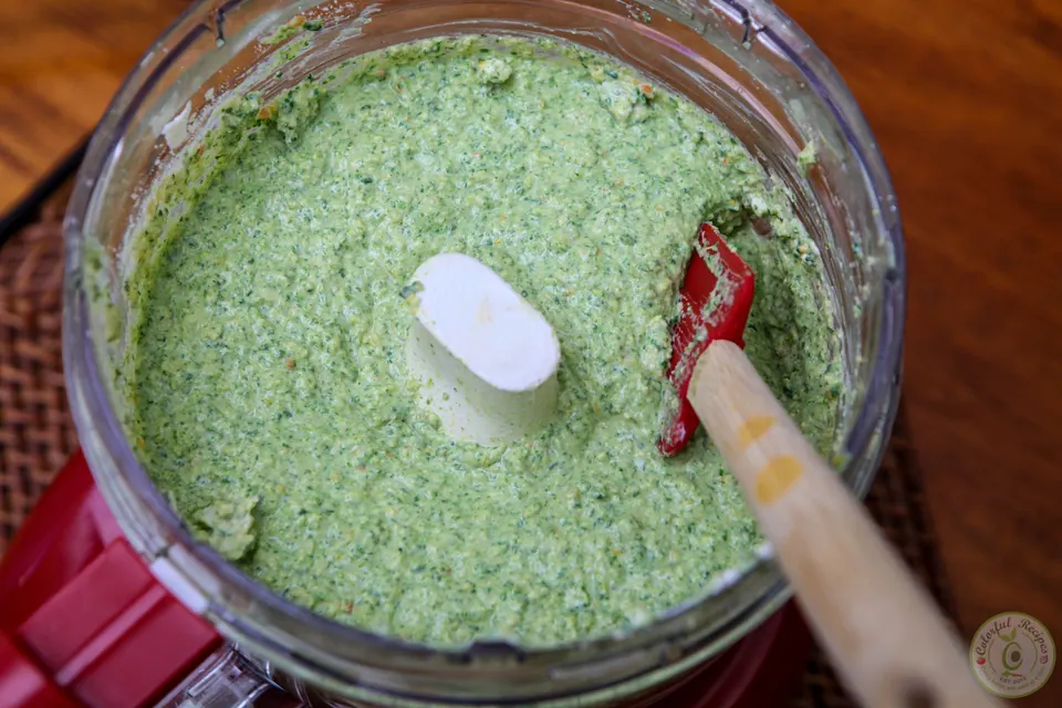 Blended artichoke spinach dip mixture in a food processor
