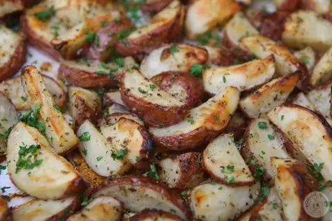 Pan of crispy Italian ranch roasted red potatoes with fresh parsley