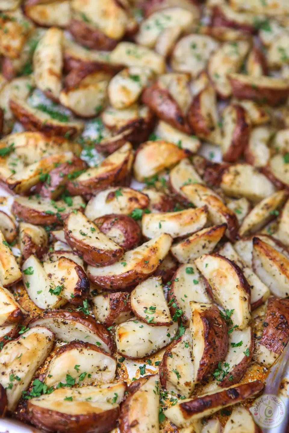 Pan of crispy Italian ranch roasted red potatoes with fresh parsley
