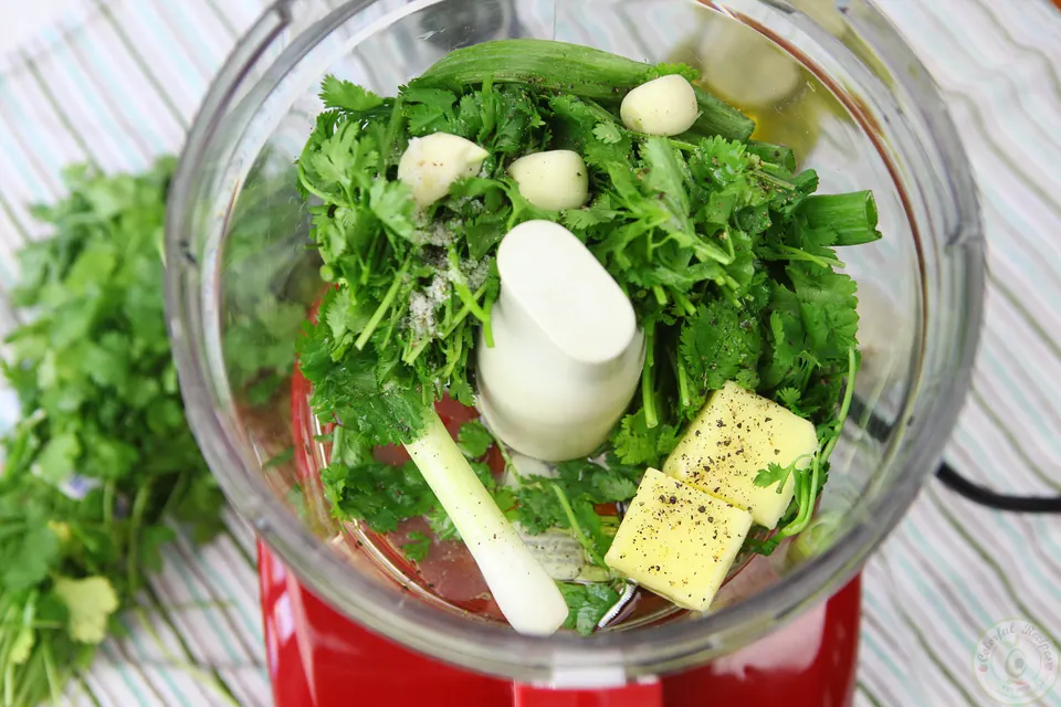 Butter, cilantro, garlic and green onion in a food processor for cilantro garlic citrus butter