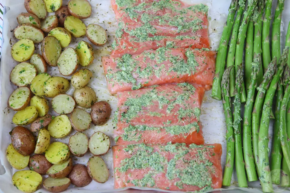 Overhead view of one pan salmon with roasted baby potatoes and asparagus spears