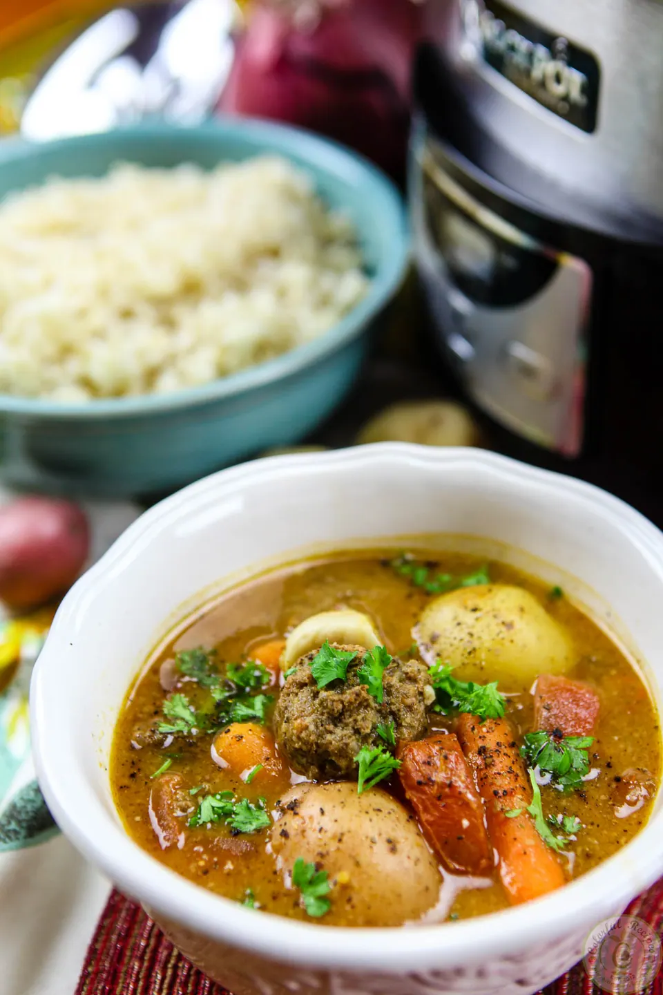 Bowl of comforting slow cooker Lebanese kafta stew with meatballs, potatoes and carrots
