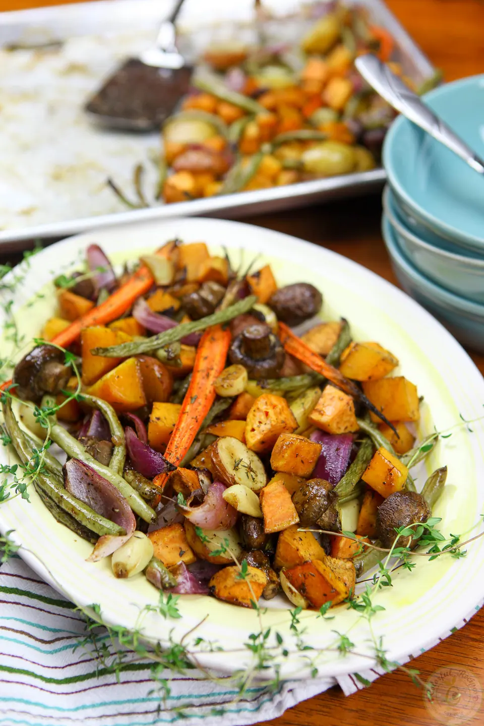 Platter of roasted fall vegetables with sweet potato, butternut squash, carrots and mushrooms