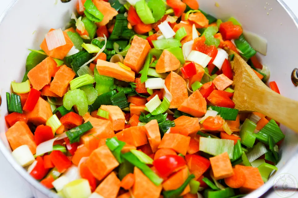 Chopped leek, carrots, celery and red bell pepper for red lentil veggie soup
