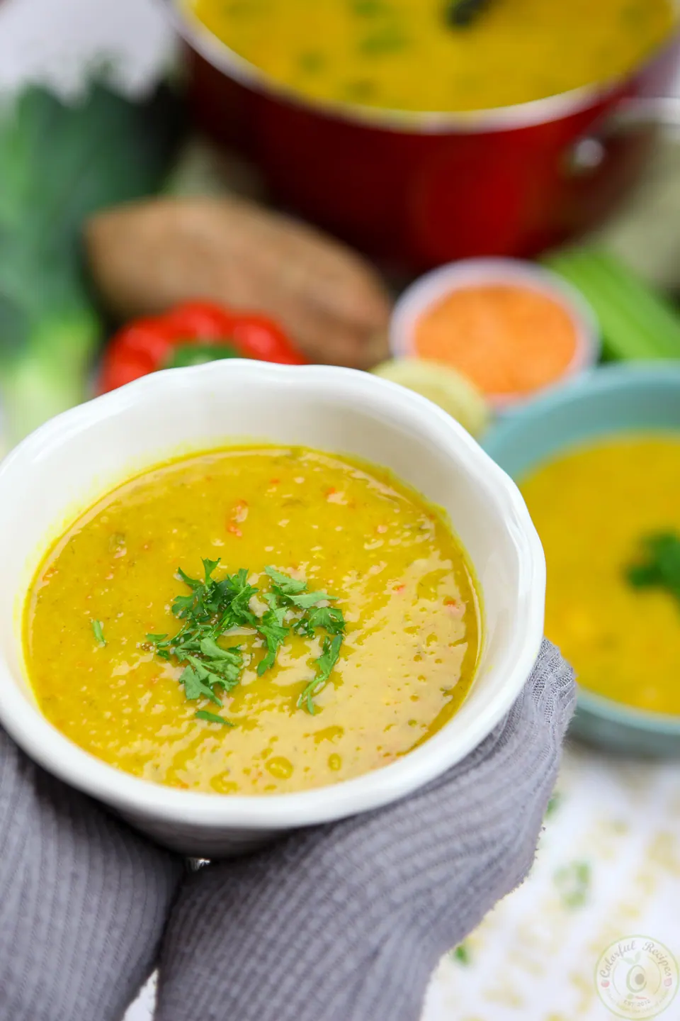 Toddler's bowl of yellow red lentil veggie soup
