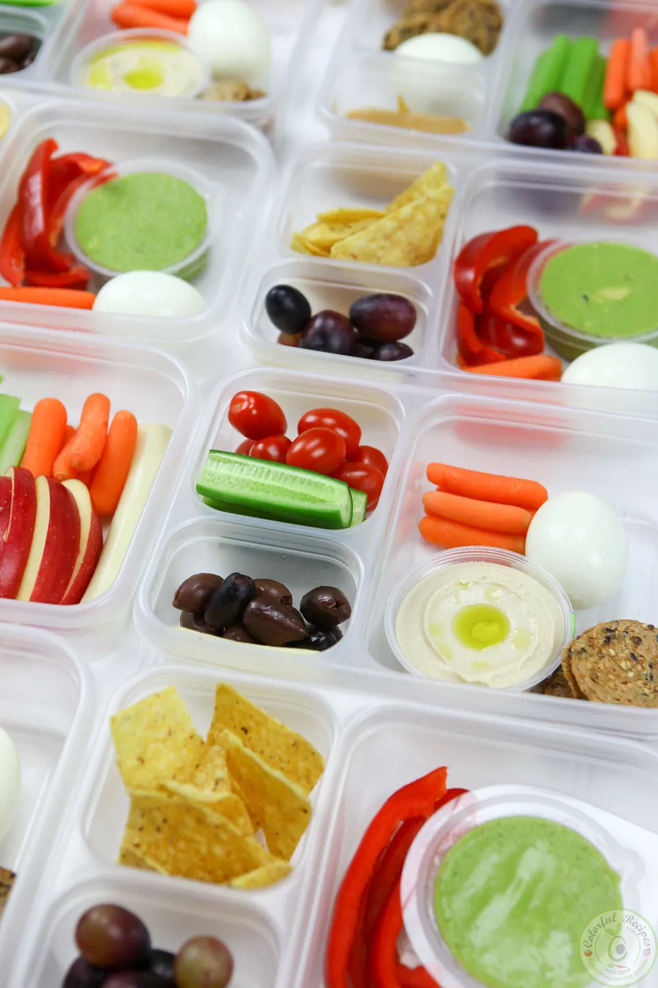 Protein bento snack boxes filled with veggies, fruit, eggs, cheese and dips
