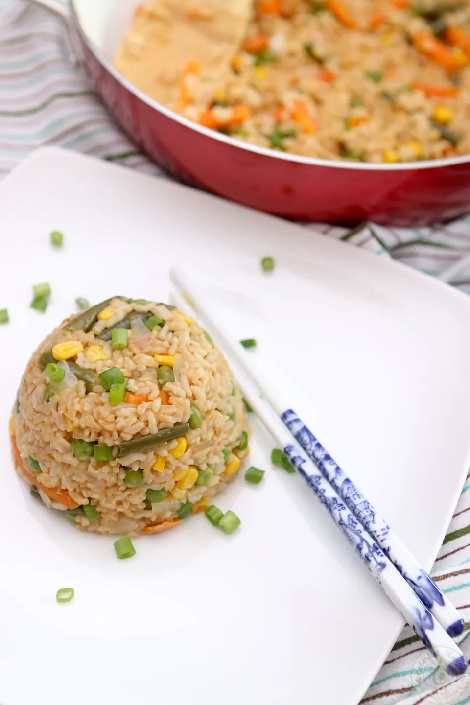 Mound of easy 15 minute vegan fried rice with chopsticks
