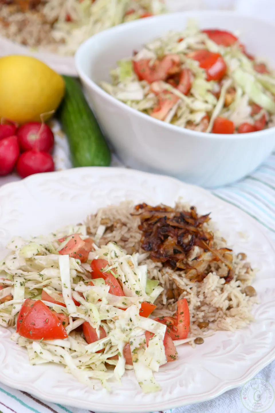 Lebanese lentil rice pilaf (mdardara) topped with caramelized onions, with cabbage tomato salad
