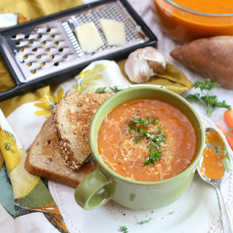 Roasted red pepper sweet potato soup with toast, Asiago cheese and a grater