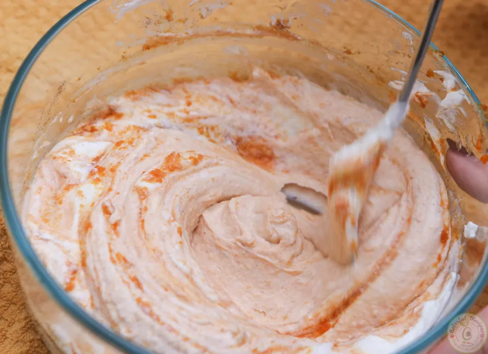 Stirring cinnamon pumpkin yogurt for the Chinese gooseberry pumpkin breakfast bowl
