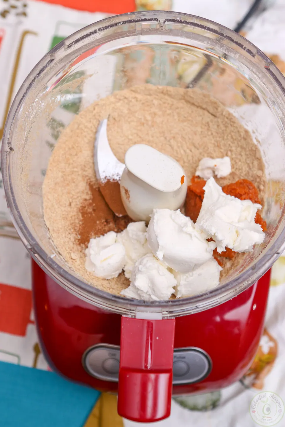Pumpkin cheesecake dough in a food processor
