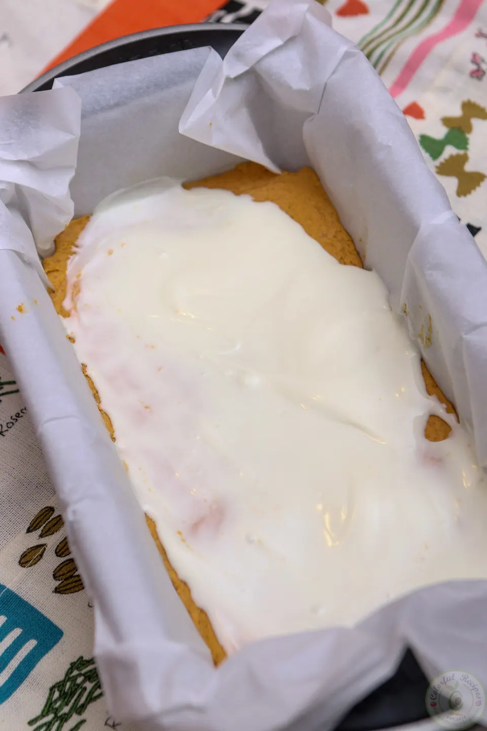 Graham cracker crumbs sprinkled over white chocolate pumpkin cheesecake