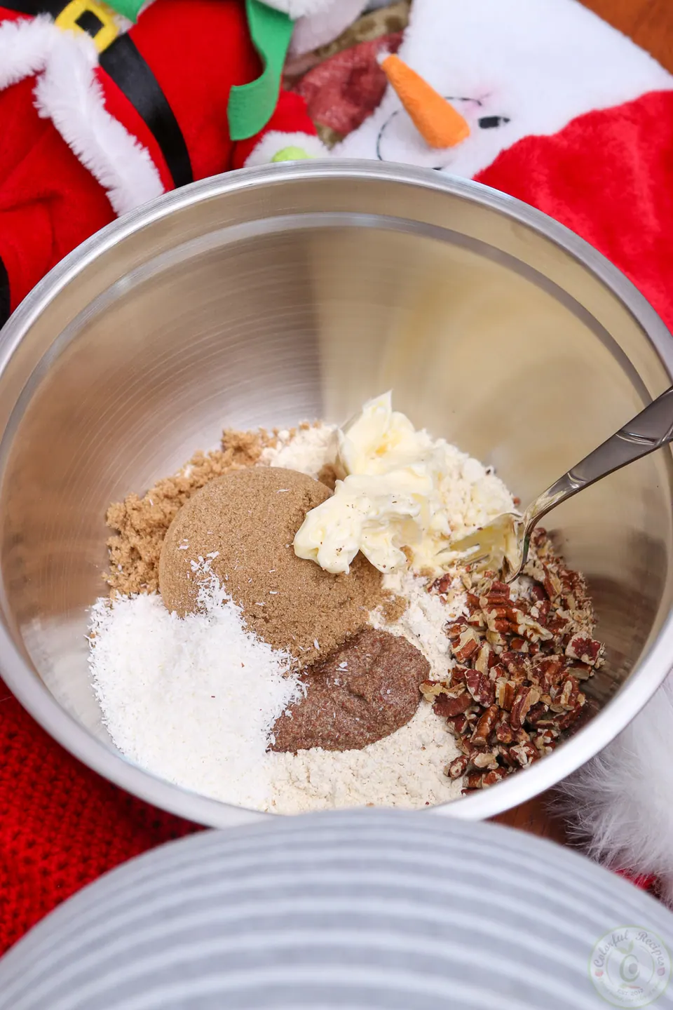 Gluten-free flour, butter, brown sugar and chopped pecans in a mixing bowl