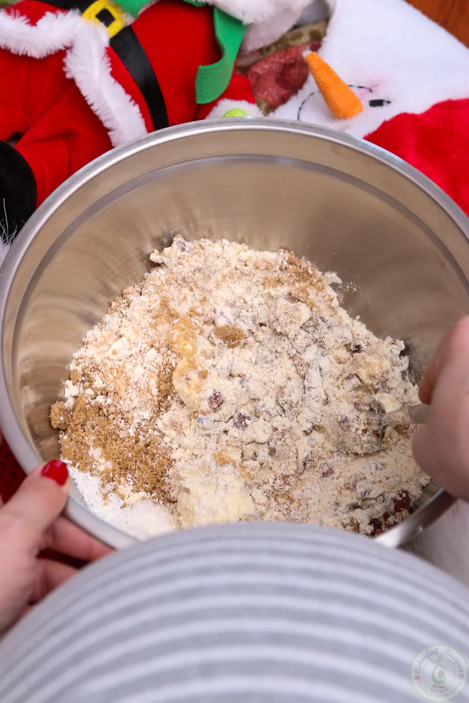 Gluten-free coconut pecan cookie dough mixed with a fork