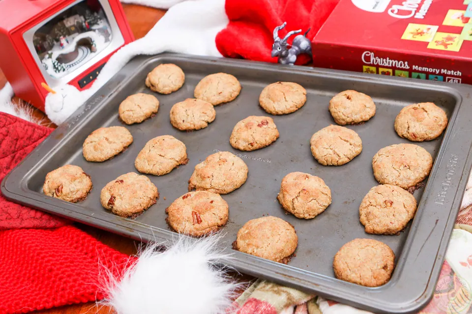 Freshly baked gluten-free coconut pecan cookies on a baking sheet