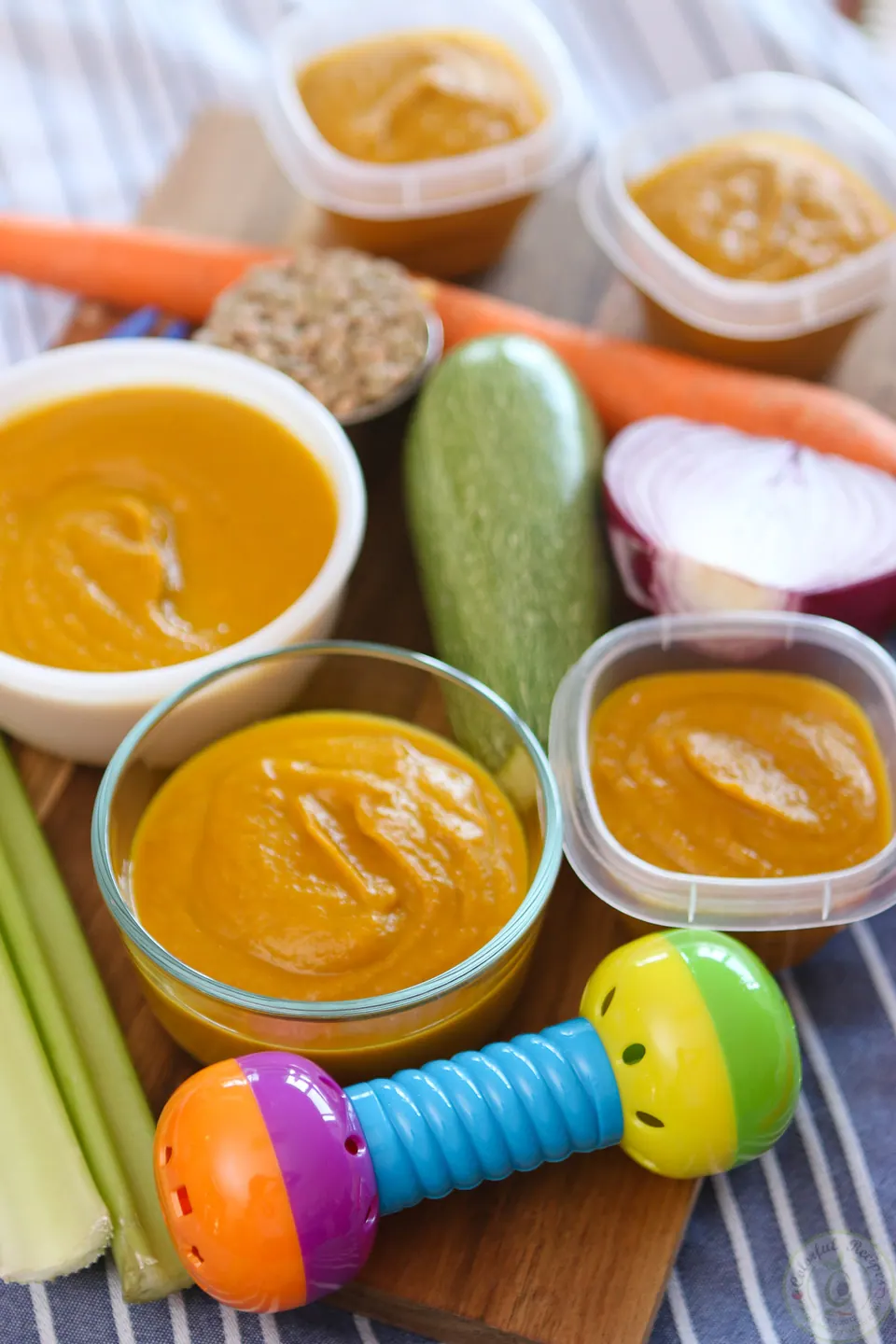 Bowls of veggie lentil baby purée with carrots, zucchini, celery and lentils