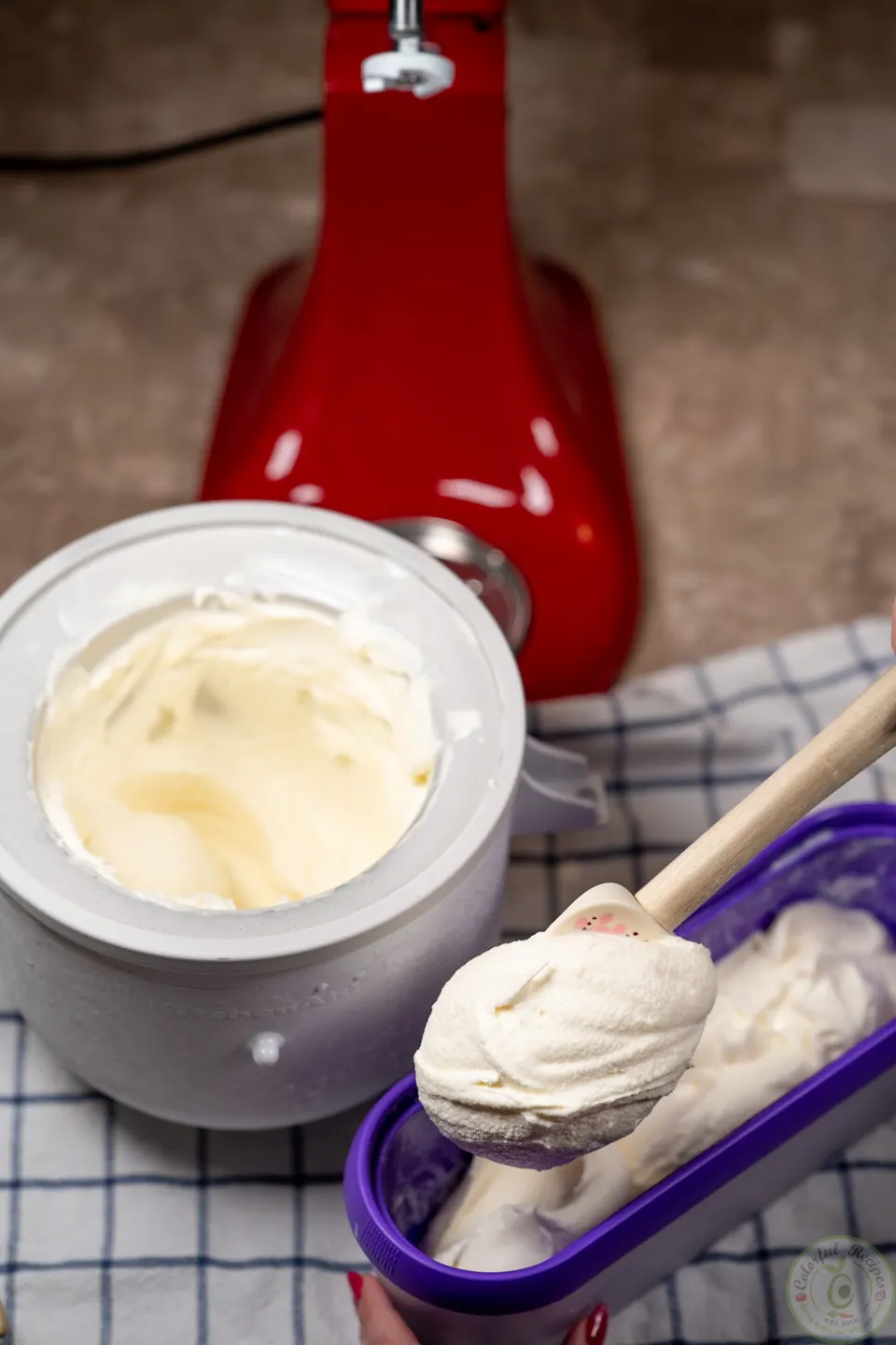 Spooning churned booza into a container