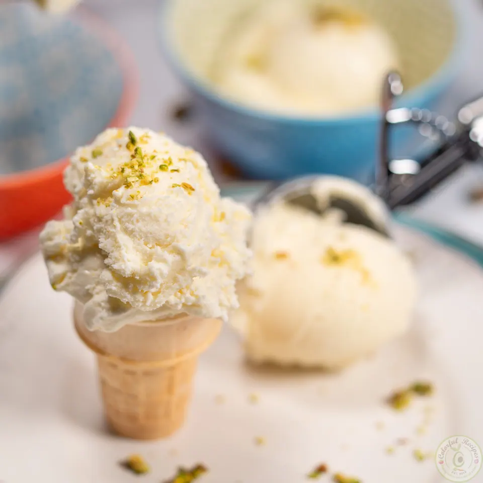 Milk ice cream booza served in a cone and a bowl with pistachios