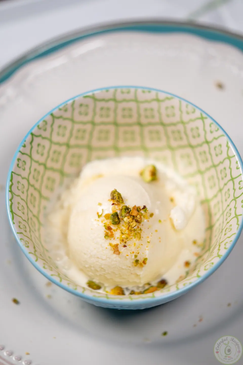Bowl of milk ice cream booza sprinkled with crushed pistachios