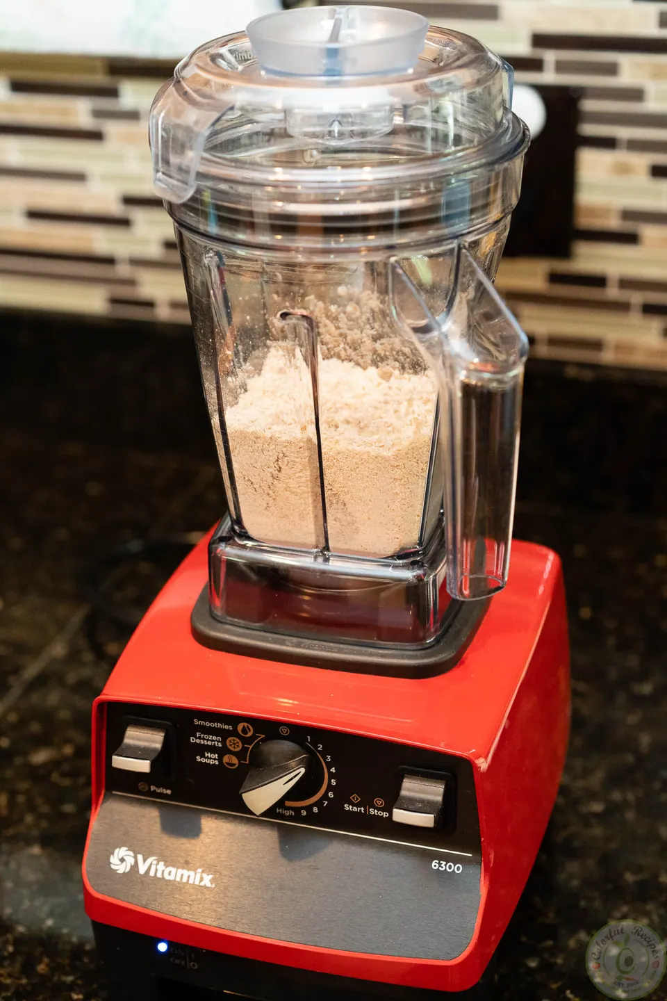 Oats ground into powder in a Vitamix blender for oatmeal pancakes