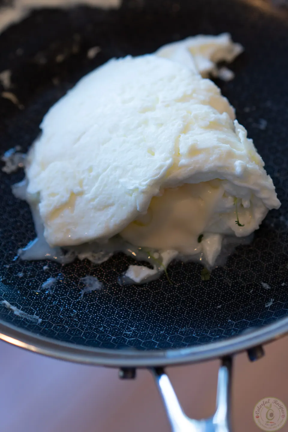 Egg whites folded over the melted cheese for the breakfast power bowl