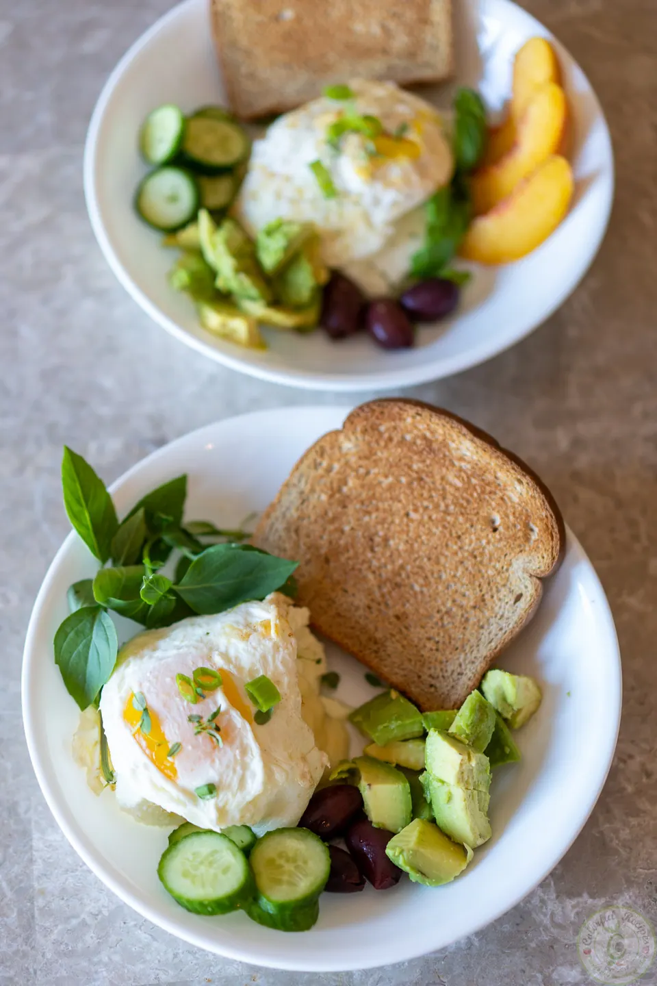 Egg whites breakfast power bowl with Swiss cheese served with whole wheat toast