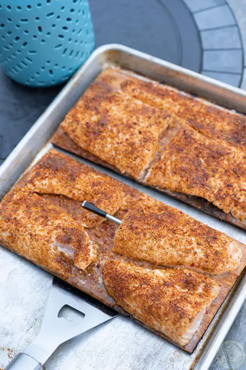 Seasoned salmon on cedar planks with a MEATER thermometer, ready to grill