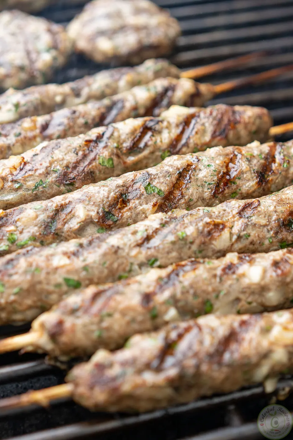 Close-up of grilled lamb kafta kabobs with grill marks