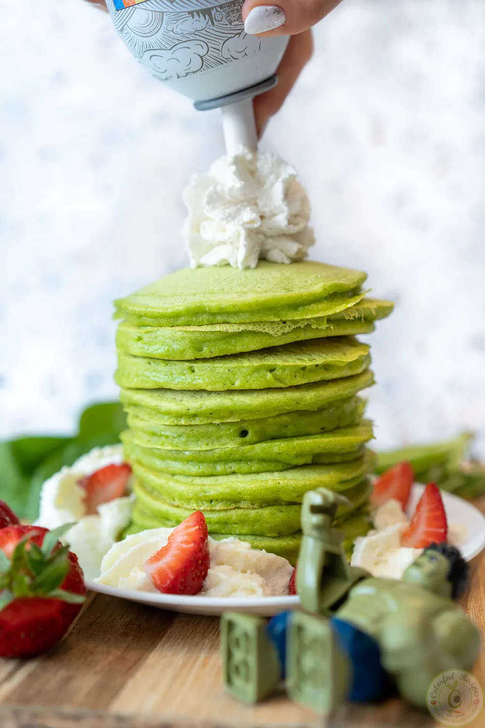 Stack of green pancakes with spinach on a plate