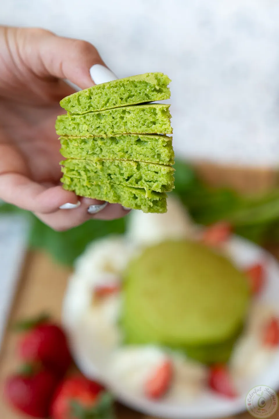 Fluffy green spinach pancakes cut to show the soft inside