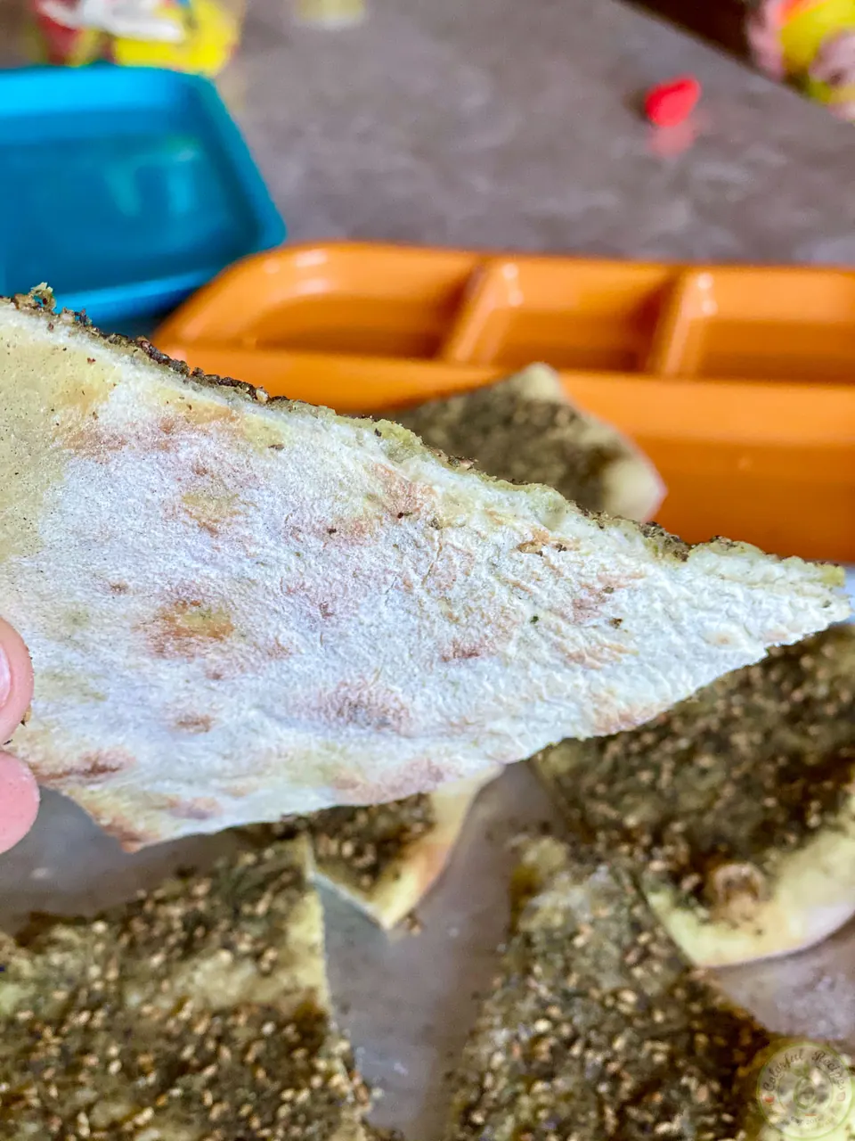 Golden underside of a Lebanese mankousheh slice