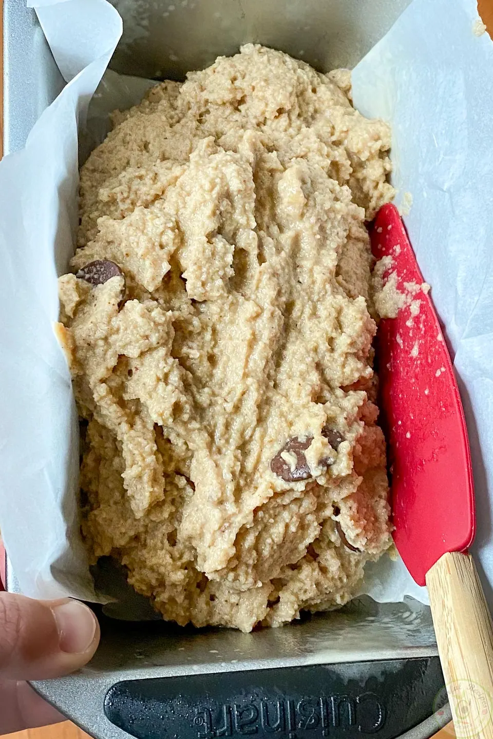 Almond flour banana bread cut into slices on parchment paper