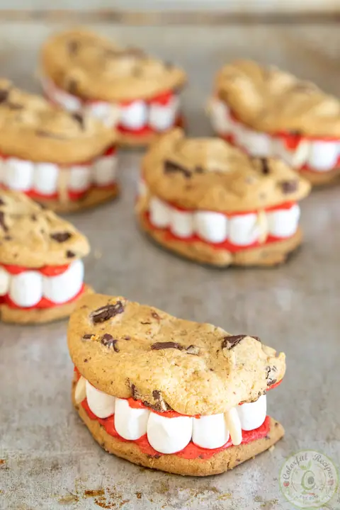Vampire dentures easy Halloween cookies with marshmallow teeth and red frosting gums