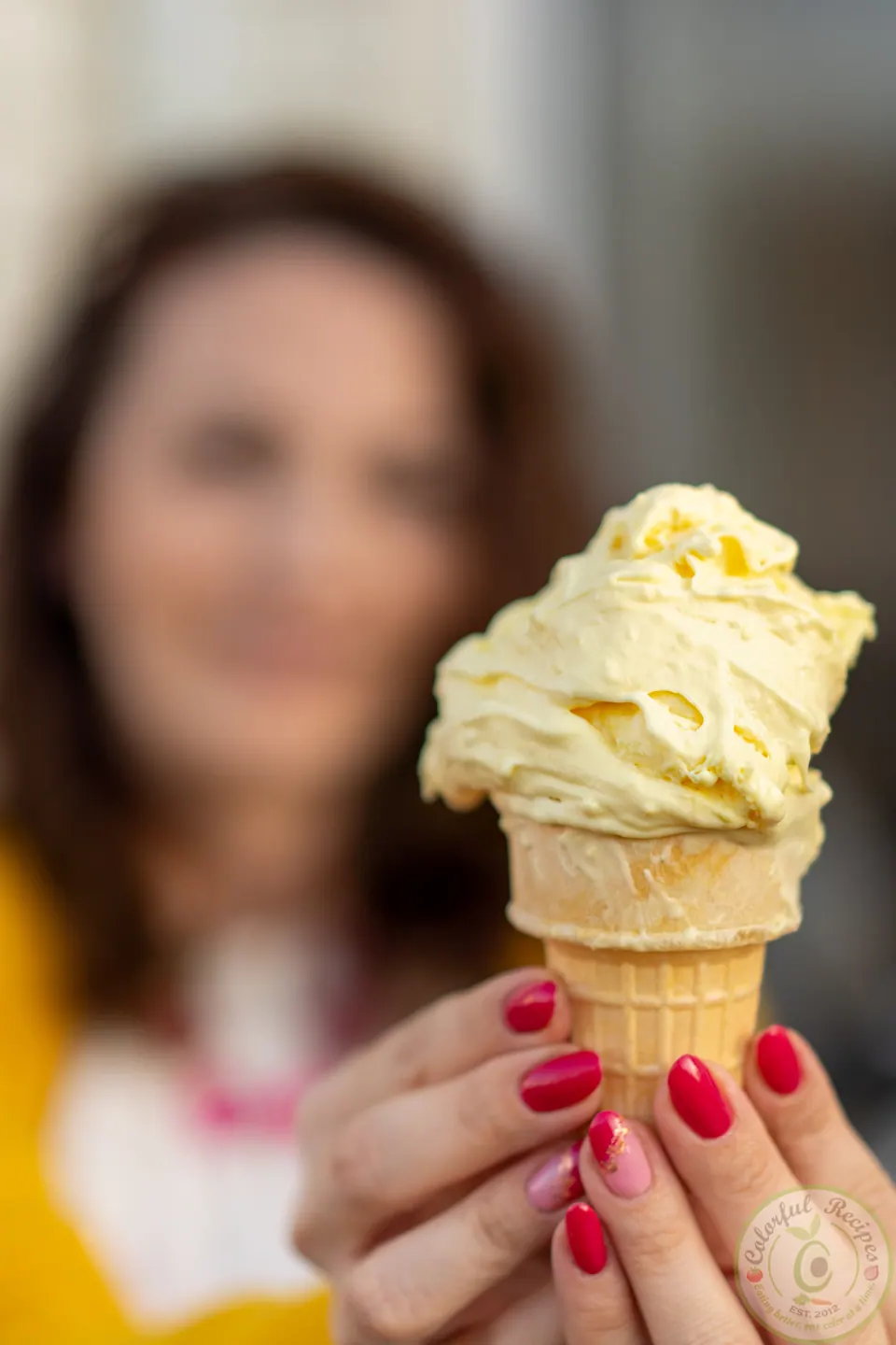 Cone of zesty lemon ice cream with a gelato-like texture