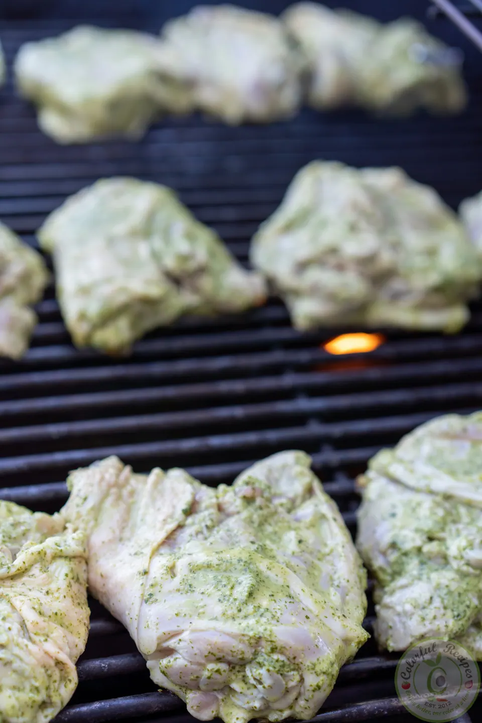 Marinated cilantro lemon garlic chicken thighs on a hot grill