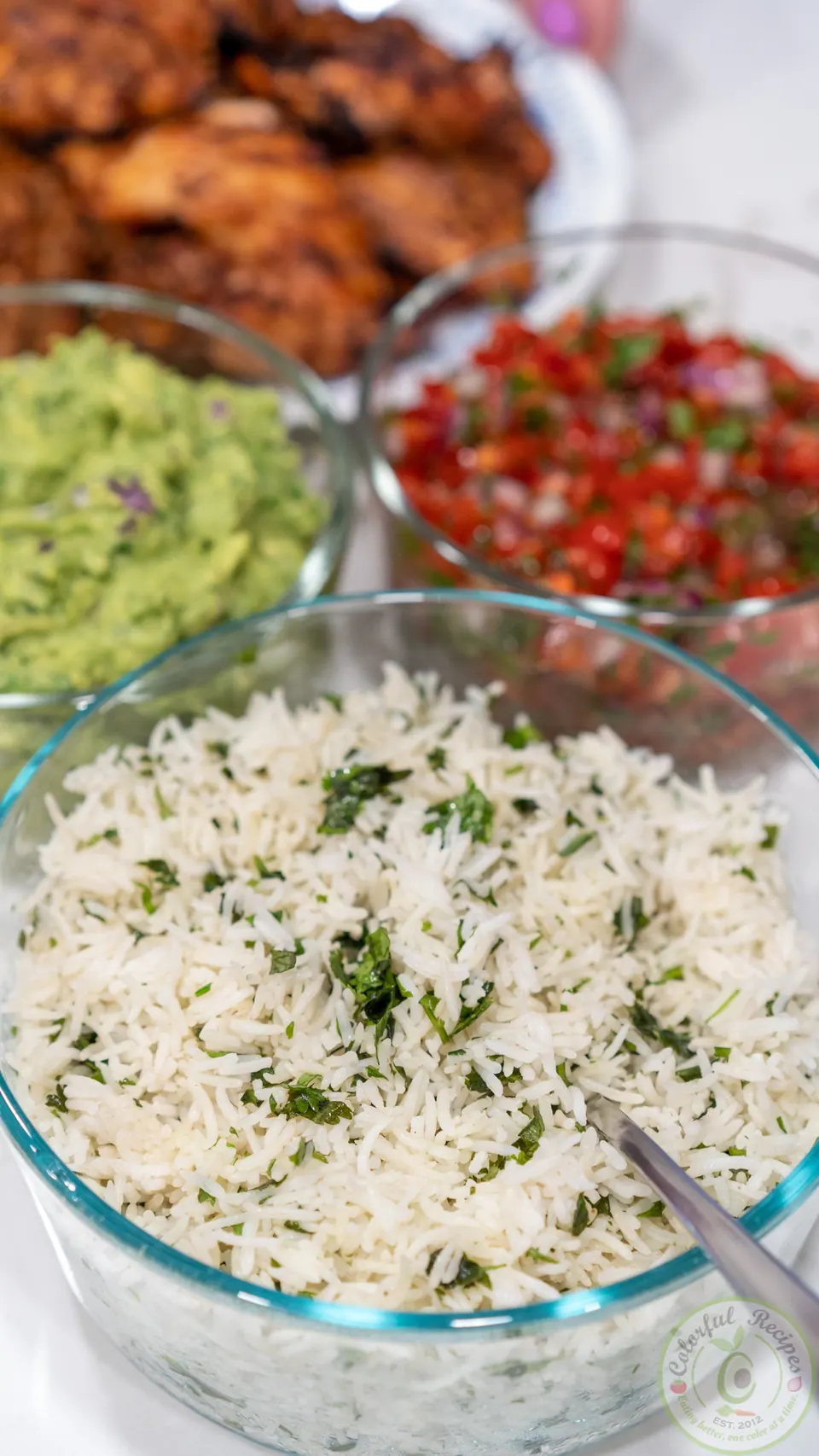 Cilantro lime rice with guacamole, salsa and grilled chicken for Chipotle-style bowls