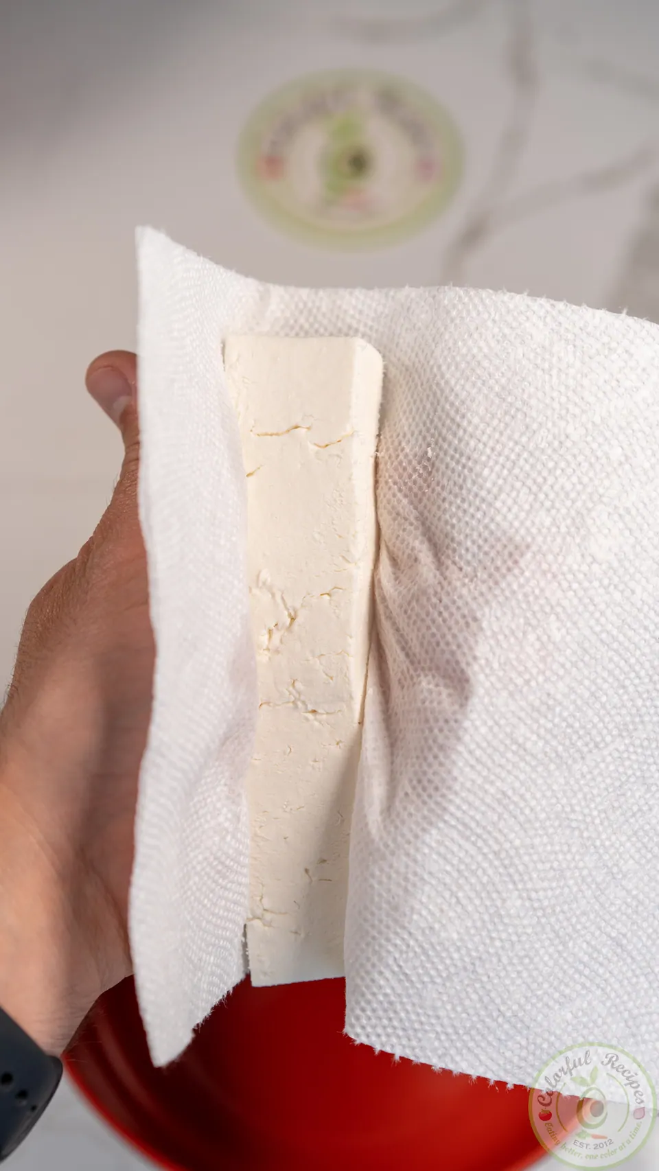 Squeezing water from Akkawi cheese