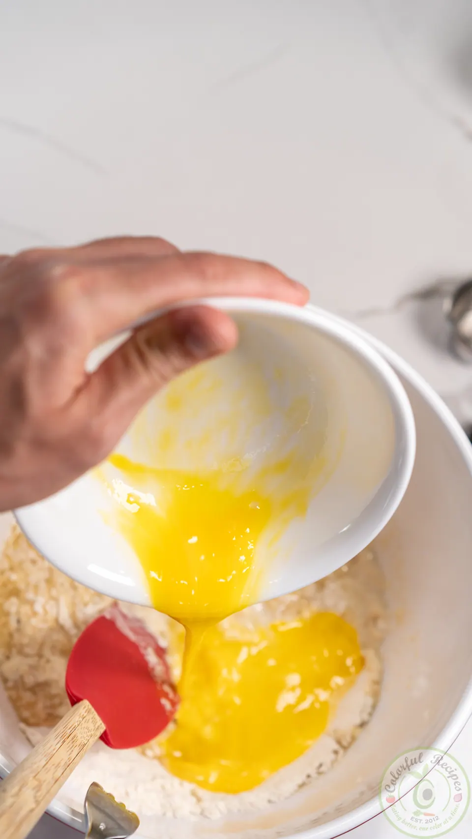 Adding egg to manakish dough